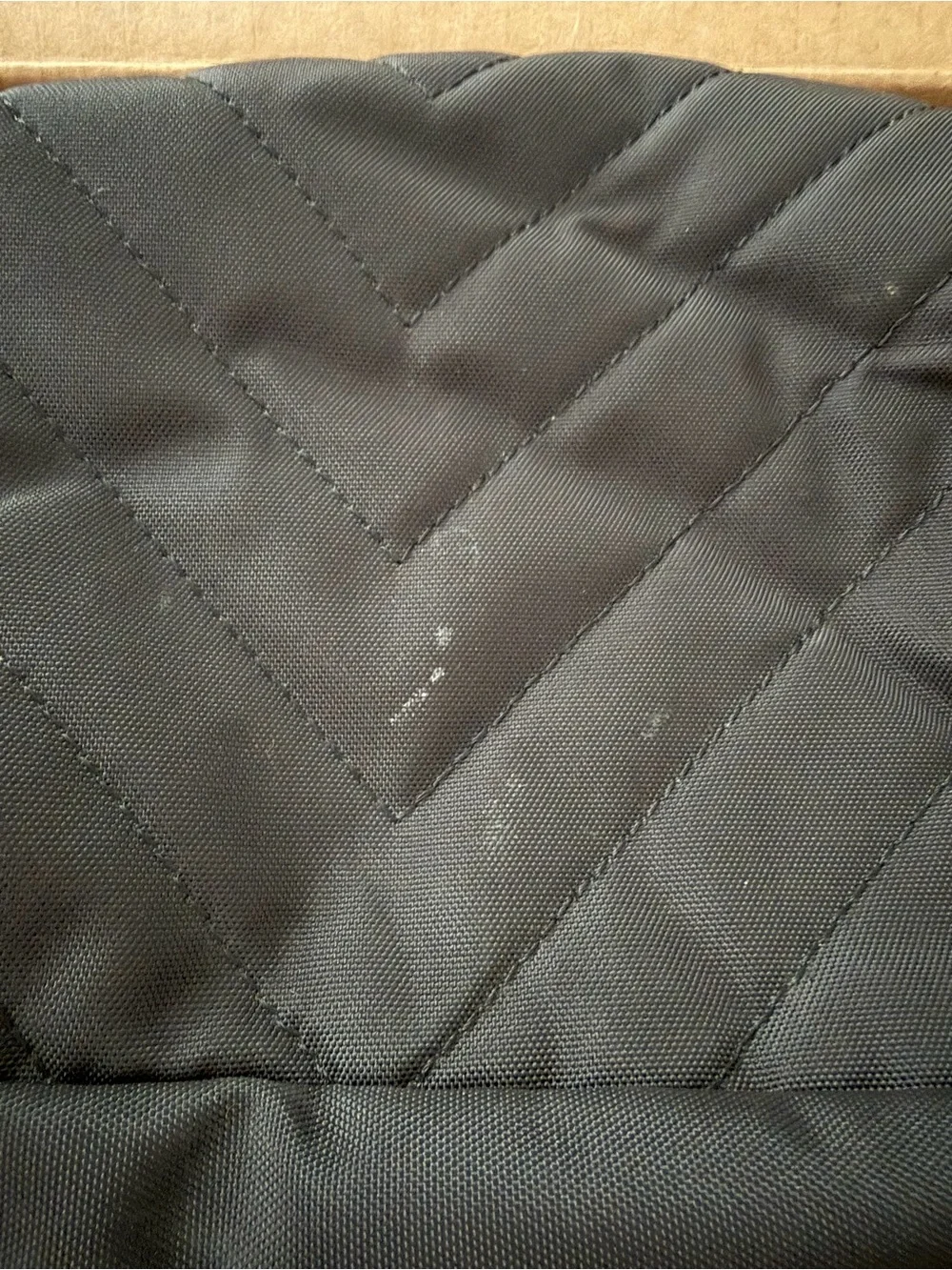 Amazon Black Quilted Backpack with Gold Accents